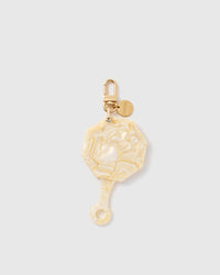 STICKYZOO folding octagonal mirror charm in Beige with pearlescent surface, gold-tone linework and branded clasp.