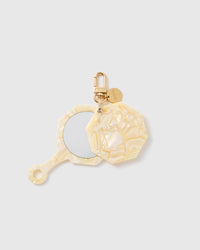 STICKYZOO Eloise Moon Glow Mirror Charm open to reveal the compact mirror beneath its pearlescent beige cover.