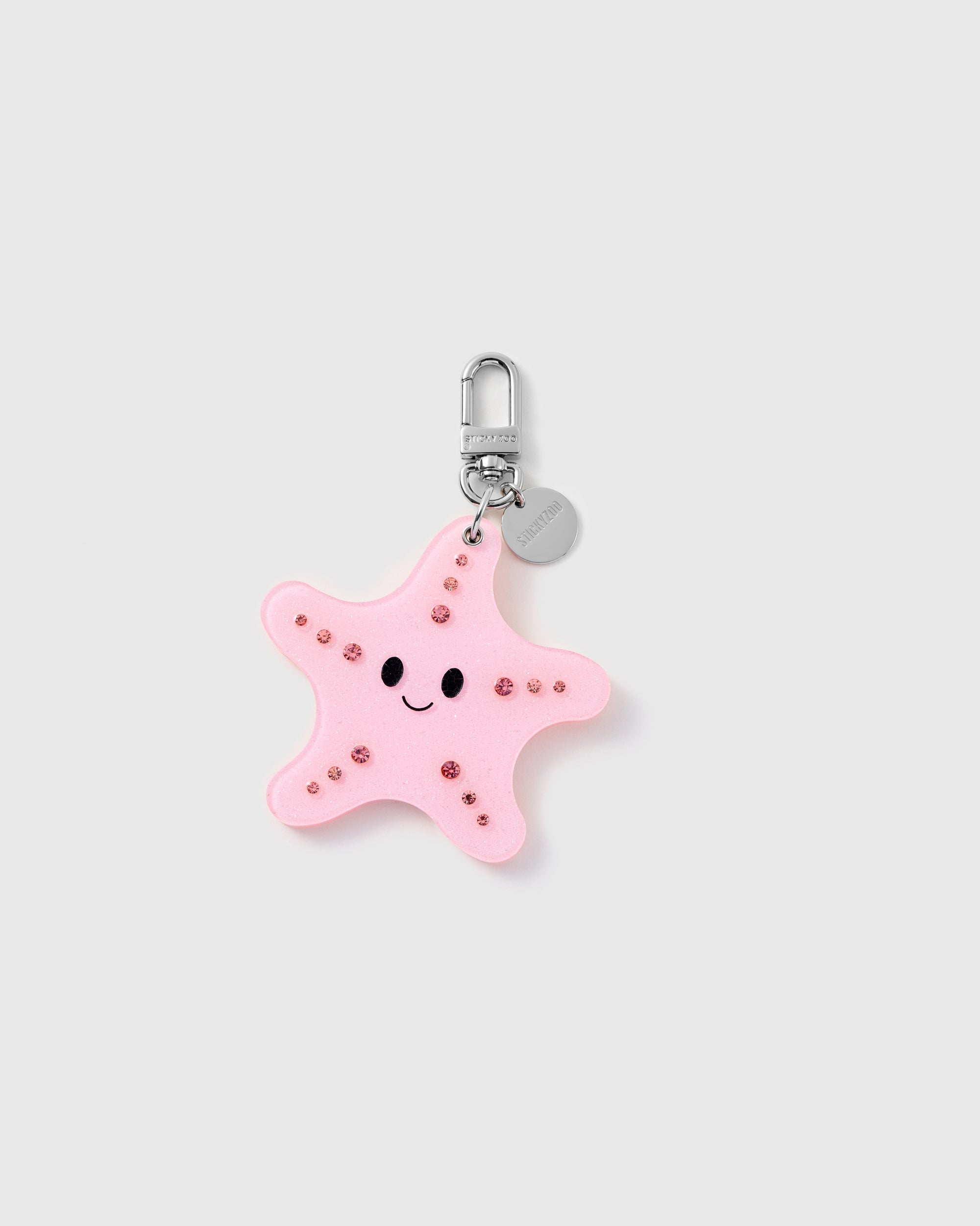 STICKYZOO Stella Starfish Mirror Charm closed with pink sparkle accents, a graphic face and silver-tone branded clasp.