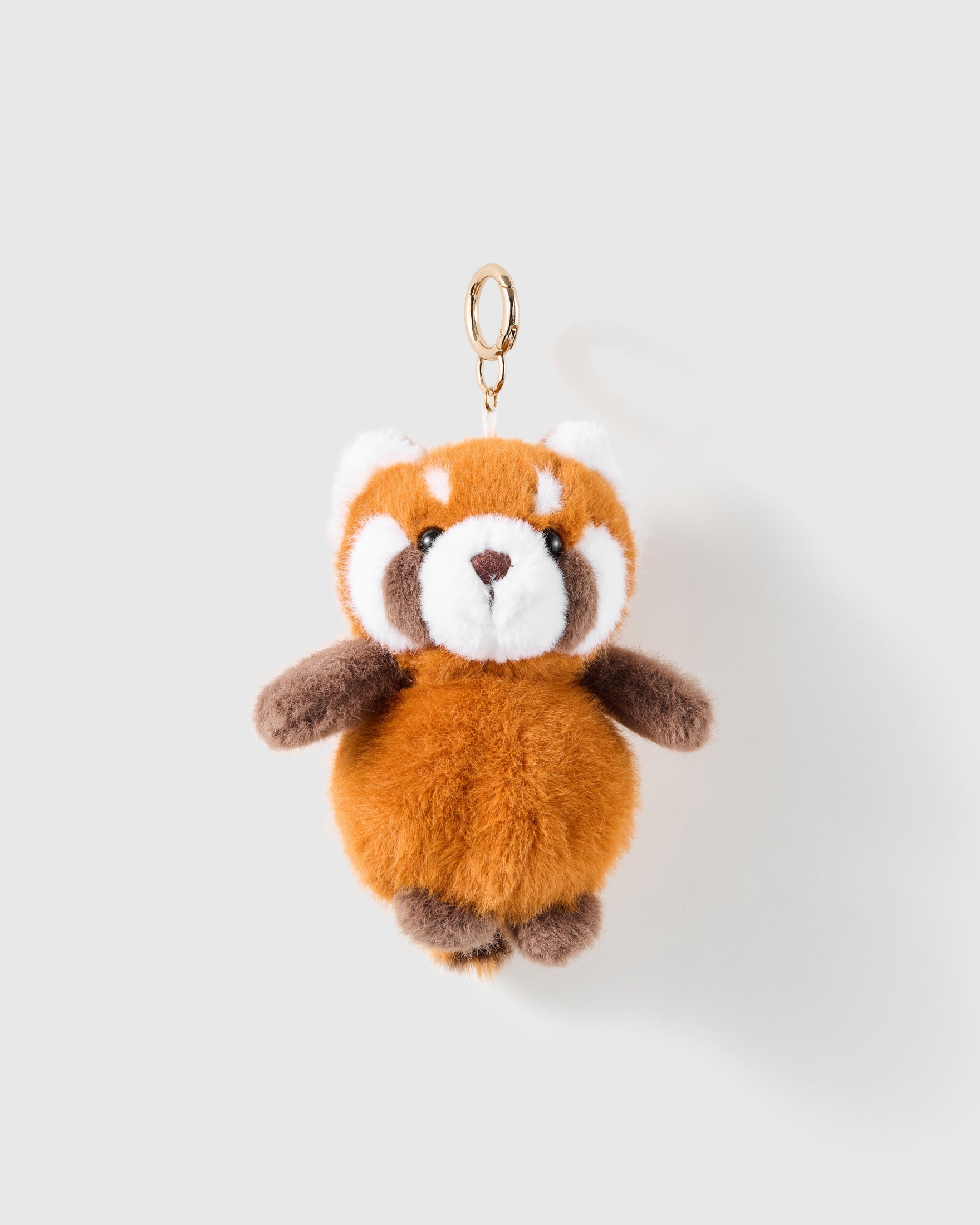 Red Panda Plush Charm with orange, white and brown plush sections shape the mask-like face, dark paws and rounded body on a light background