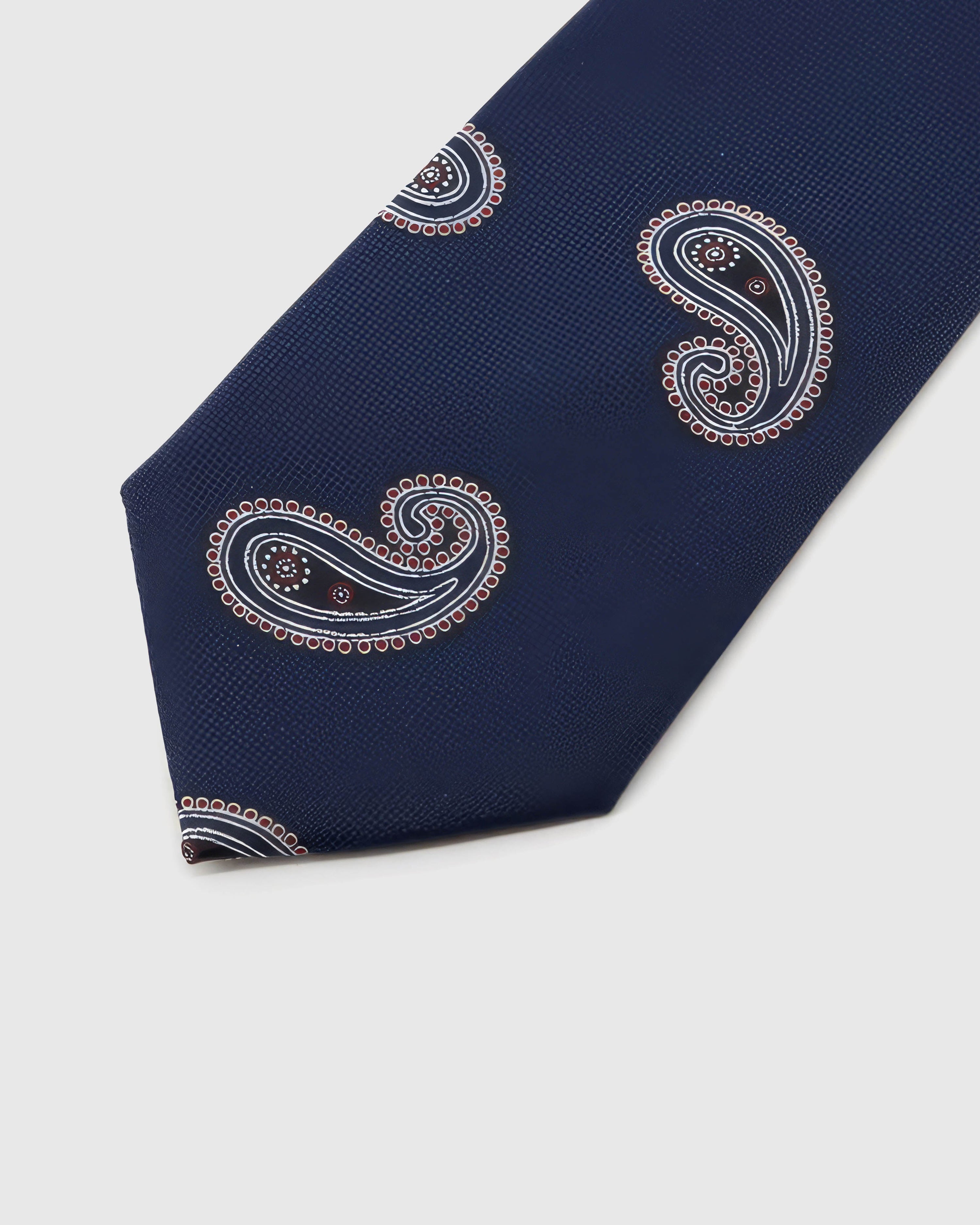 Ivory-oxblood paisleys across navy textured silk, hand-embroidered with raised thread by STICKYZOO