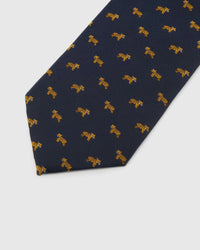 Midnight Golden Tiger Tie detail showing midnight ground with compact golden tiger motifs and the tactile silk surface.