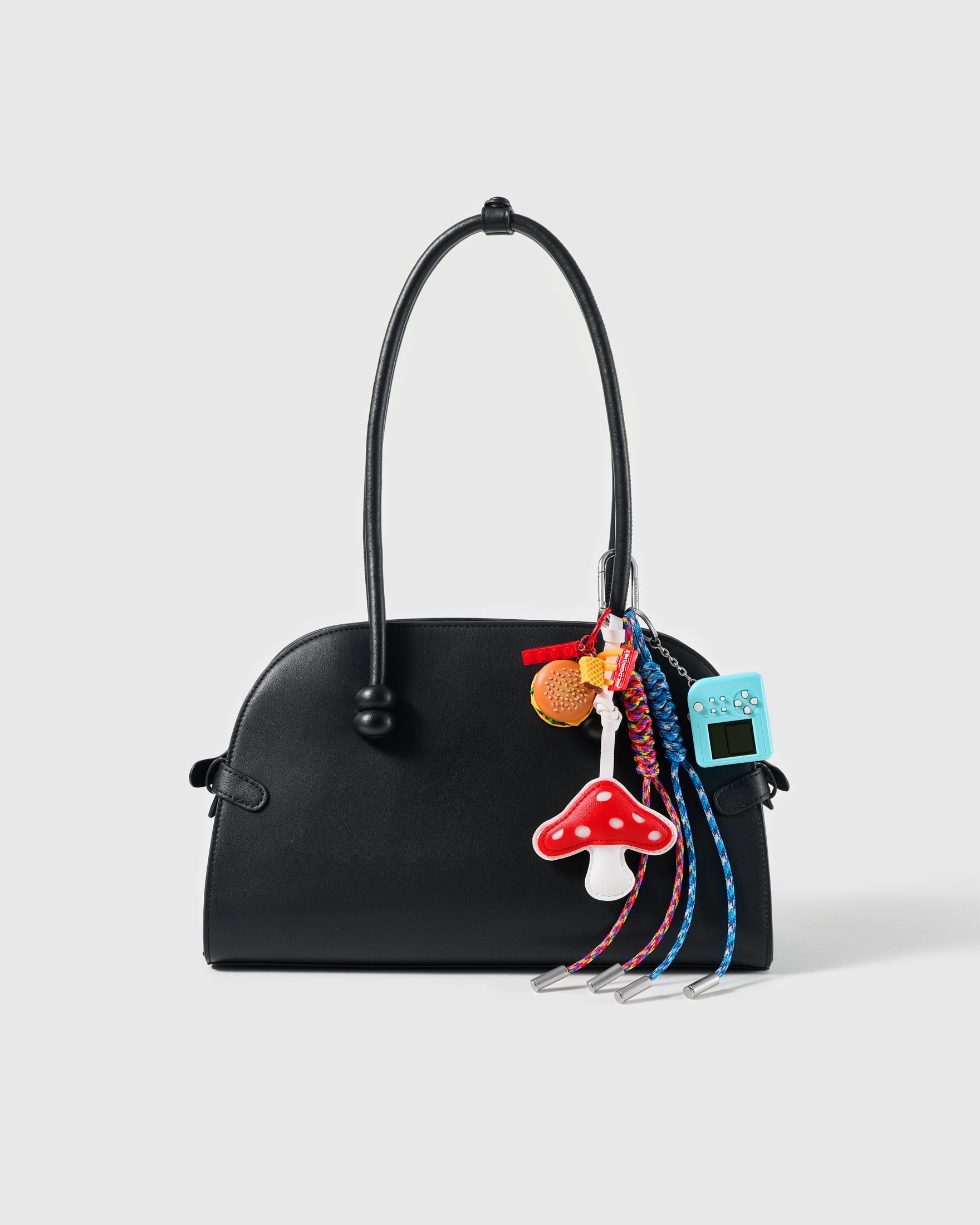 Burger Mushroom Arcade Stack Charm attached to a structured handbag to show the complete design