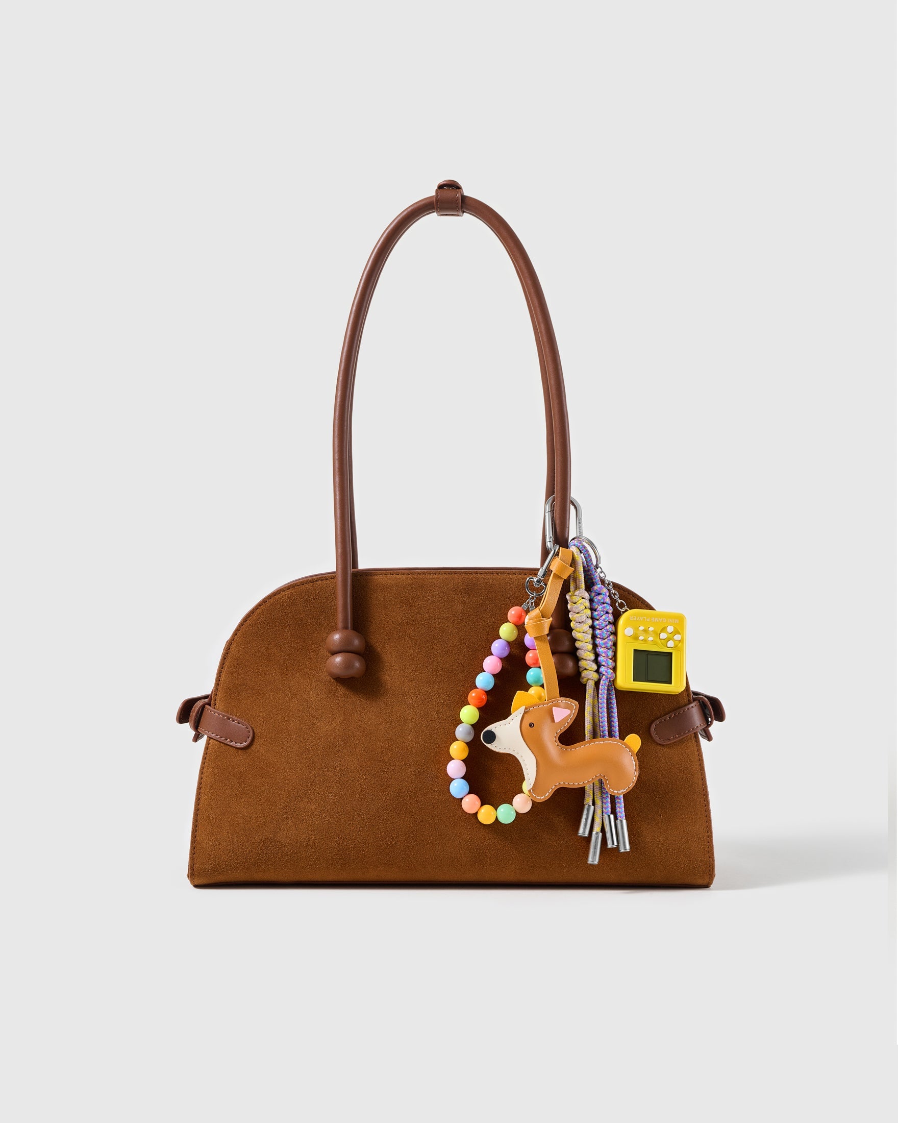 Corgi Arcade Bead Stack Charm attached to a structured handbag to show the complete design