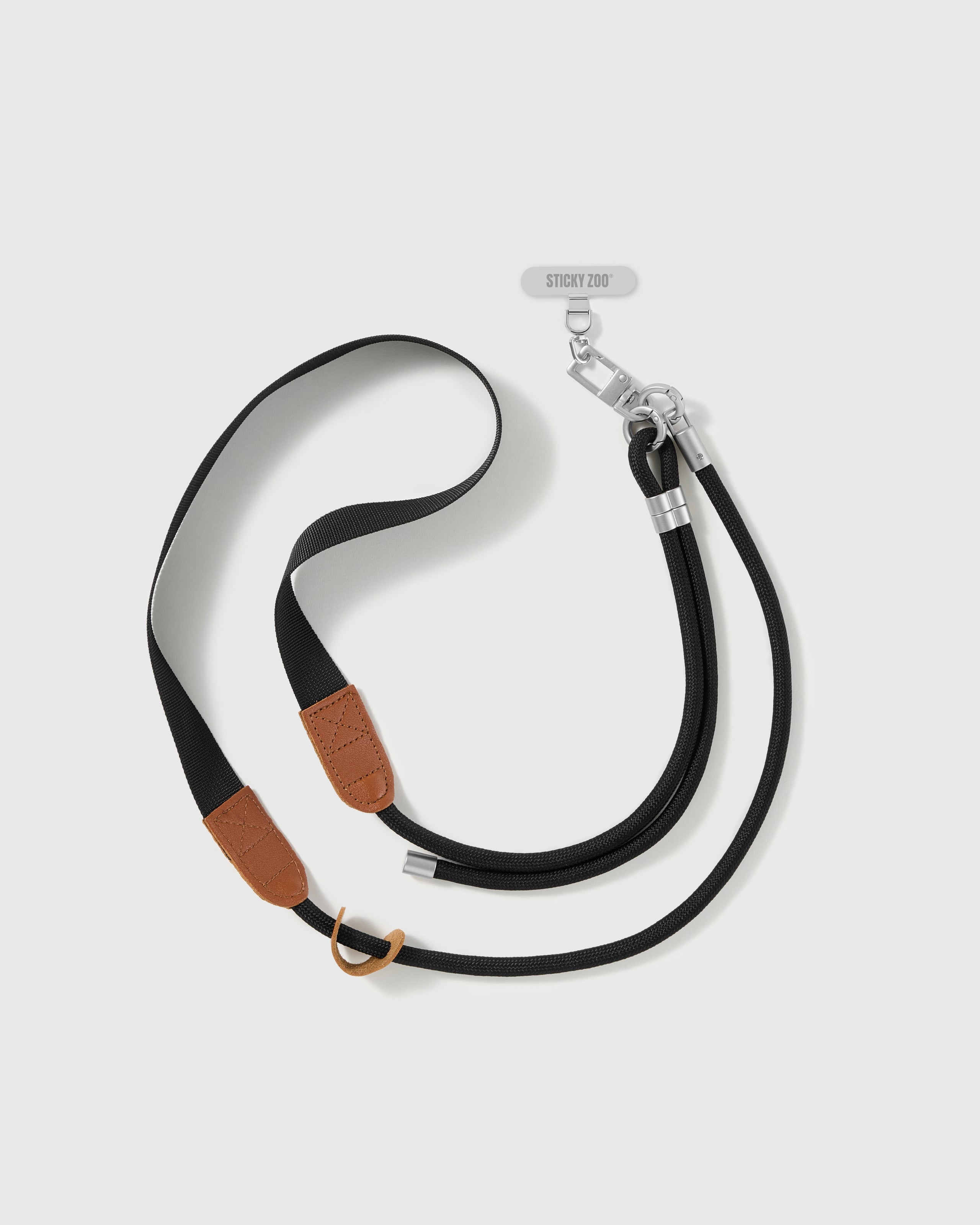 Hand-assembled black webbing and cord phone strap shown at full cross-body length with included Phone Strap Card