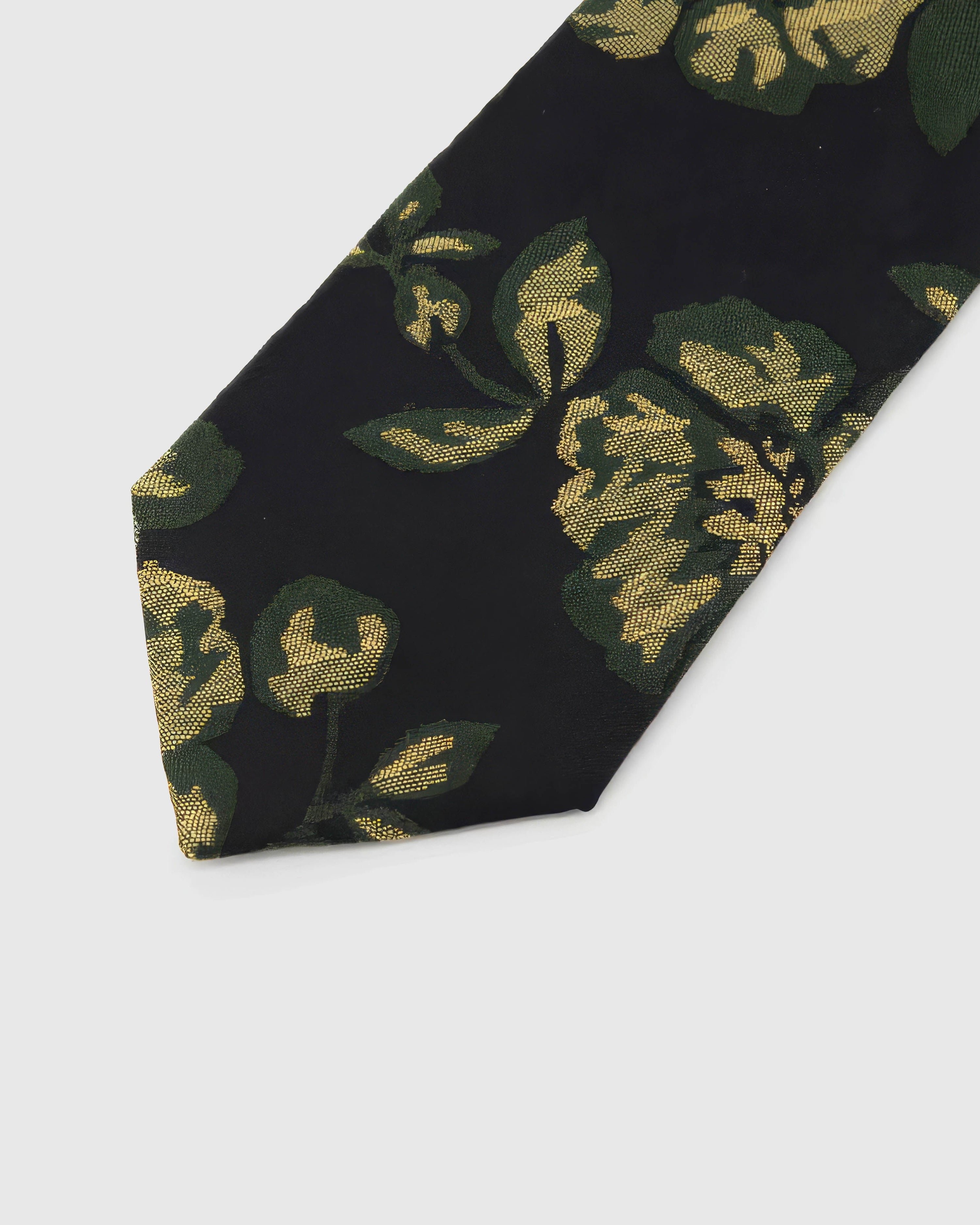 Noir Golden Rose Tie detail showing golden roses with deep-green leaves, raised thread and the tactile noir silk surface.