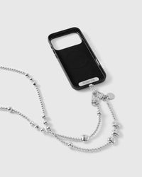 Silver-tone cross-body phone strap attached to a black phone case with the included Phone Strap Card and dual clasps.