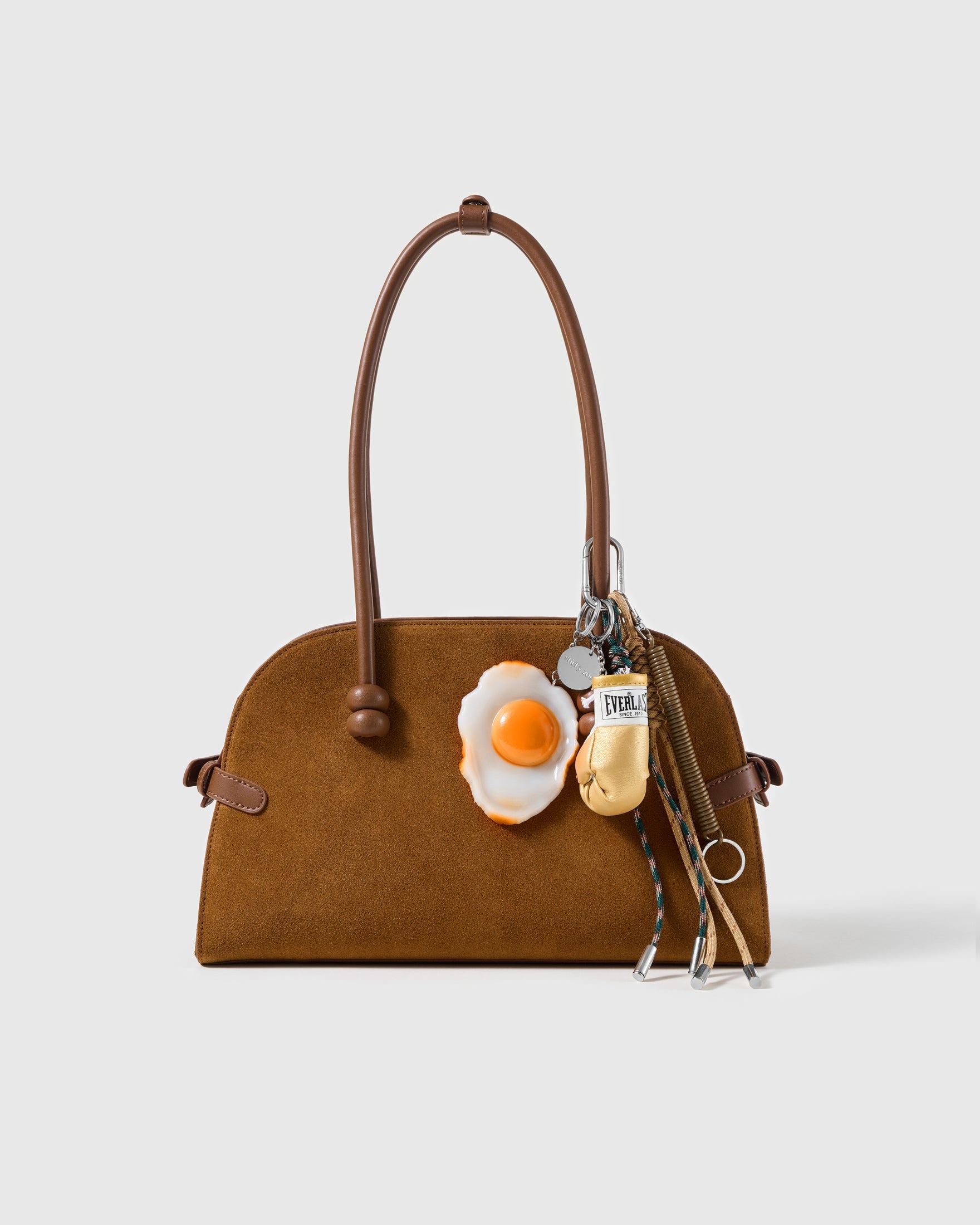 Fried Egg Boxing Stack Charm attached to a structured handbag to show the complete design