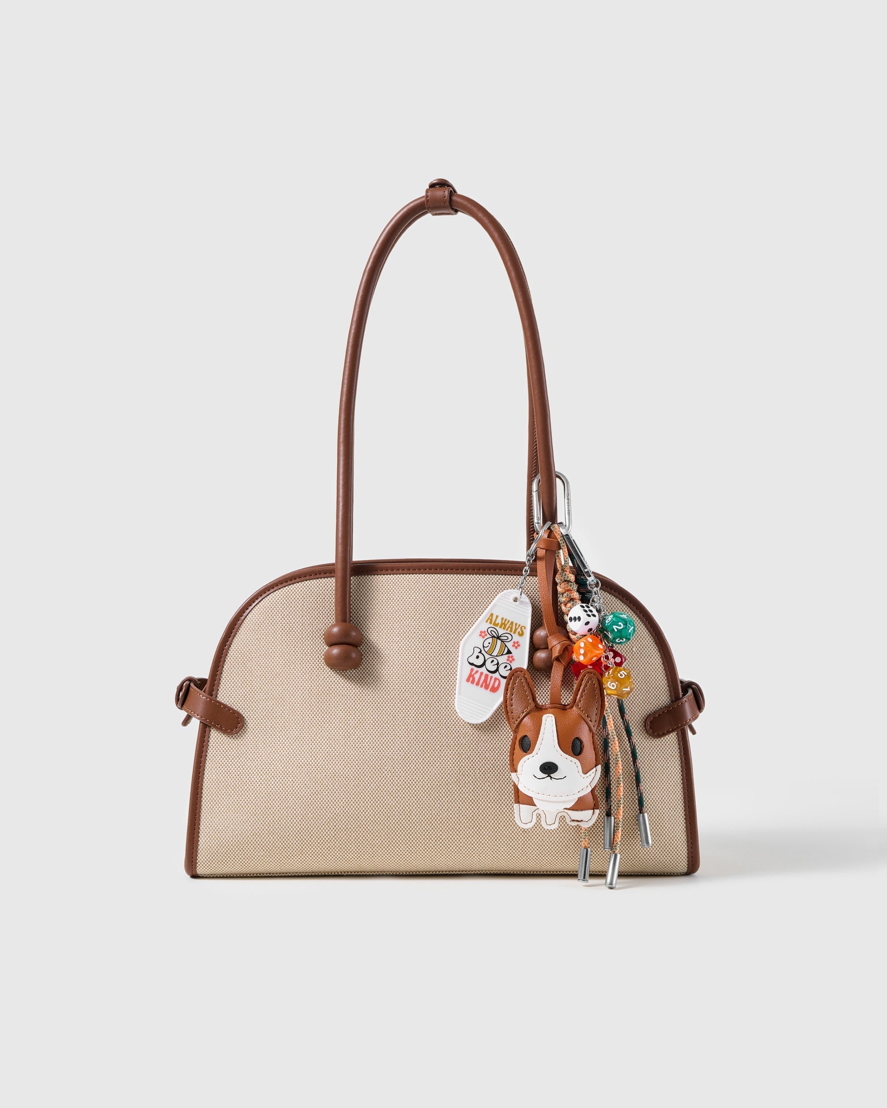 Corgi Lucky Dice Stack Charm attached to a structured handbag to show the complete design