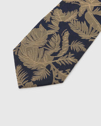 Gilt tropical foliage across navy woven silk, hand-embroidered with raised thread by STICKYZOO
