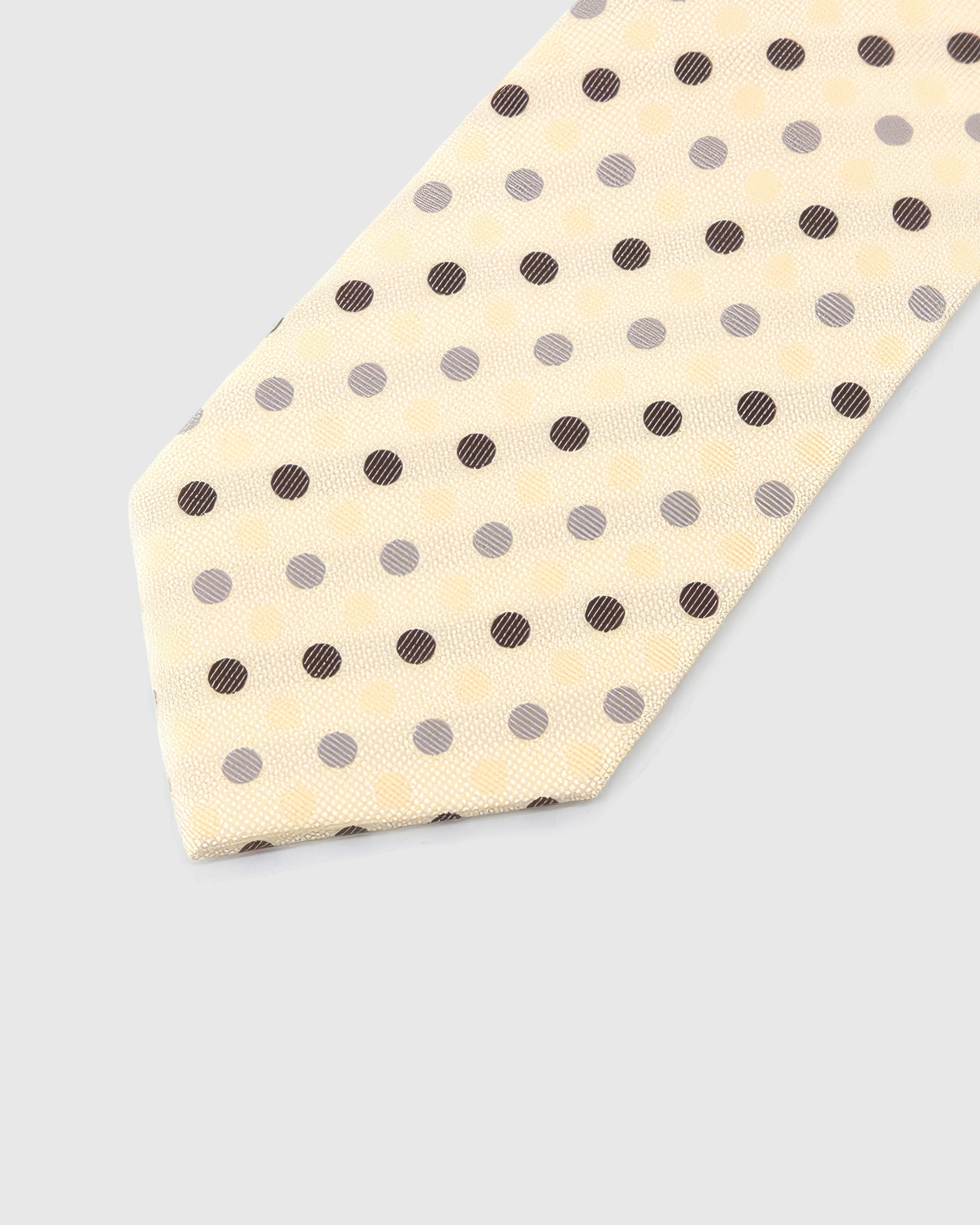 Ivory Tricolor Dot Tie blade detail showing hand-embroidered espresso, pewter and cream polka dots and silk texture by STICKYZOO