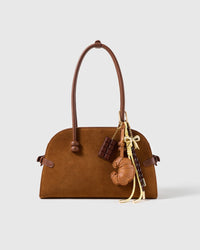 Croissant Chocolate Stack Charm attached to a structured handbag to show the complete design