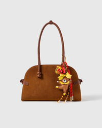 STICKYZOO Burger Break Teddy Stack Charm clipped to a brown handbag