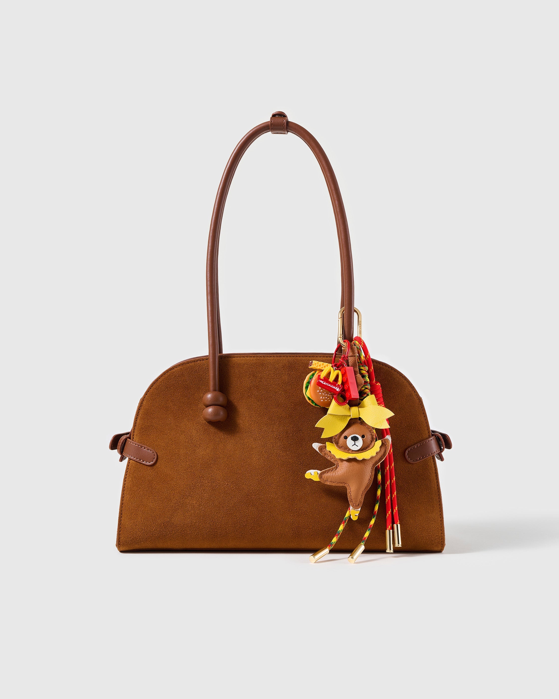 STICKYZOO Burger Break Teddy Stack Charm clipped to a brown handbag