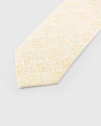 Ivory Gilded Grid Tie detail showing pale-gold irregular grid, raised thread and the tactile ivory silk surface.