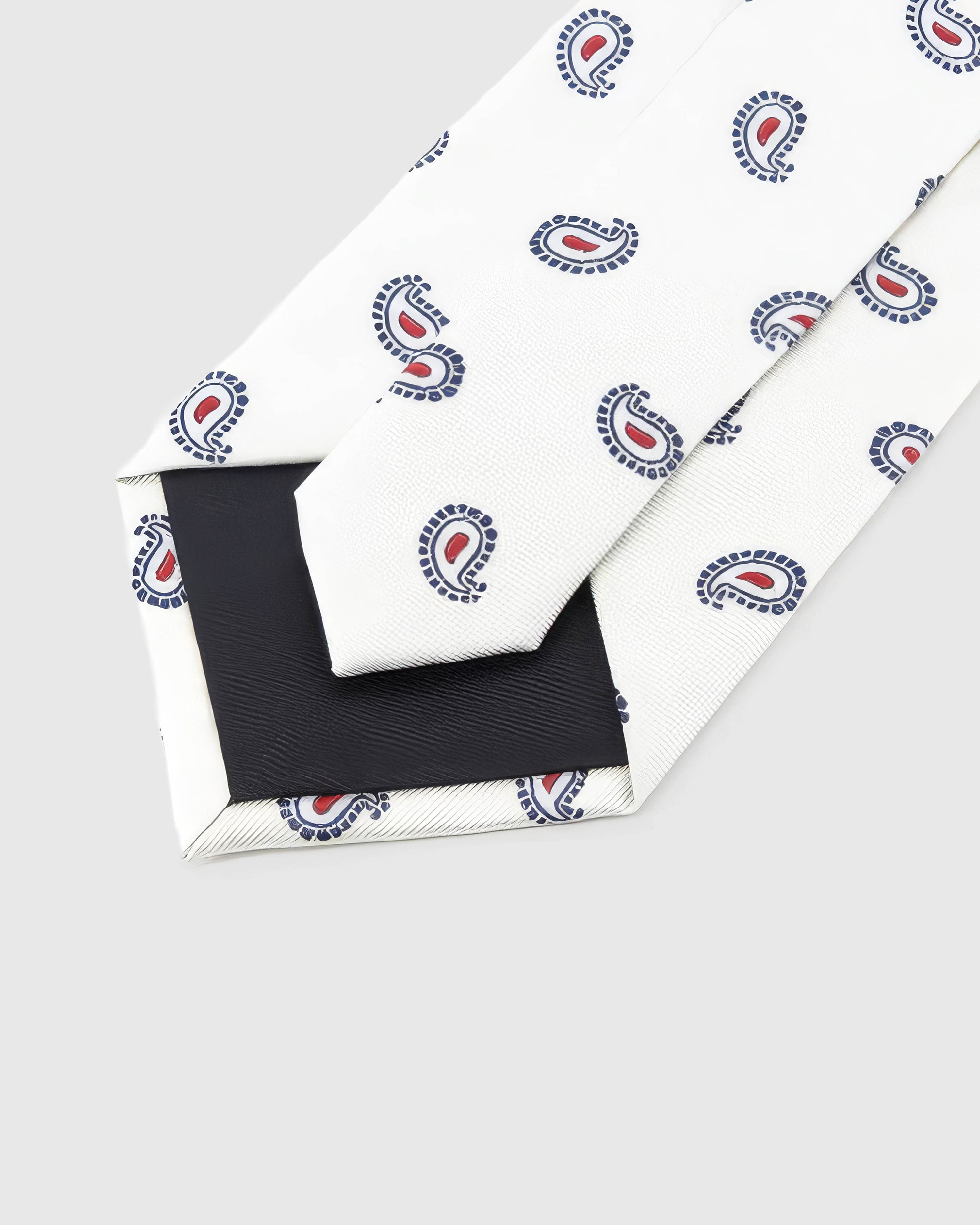 STICKYZOO Ivory Tricolor Paisley Tie reverse showing structured interlining and hand-finished slip stitching, 145 × 8 cm.
