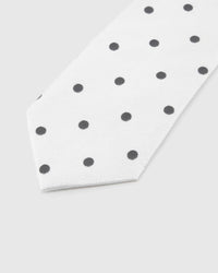 Pearl Onyx Dot Tie blade detail showing hand-embroidered onyx polka dots and silk texture by STICKYZOO