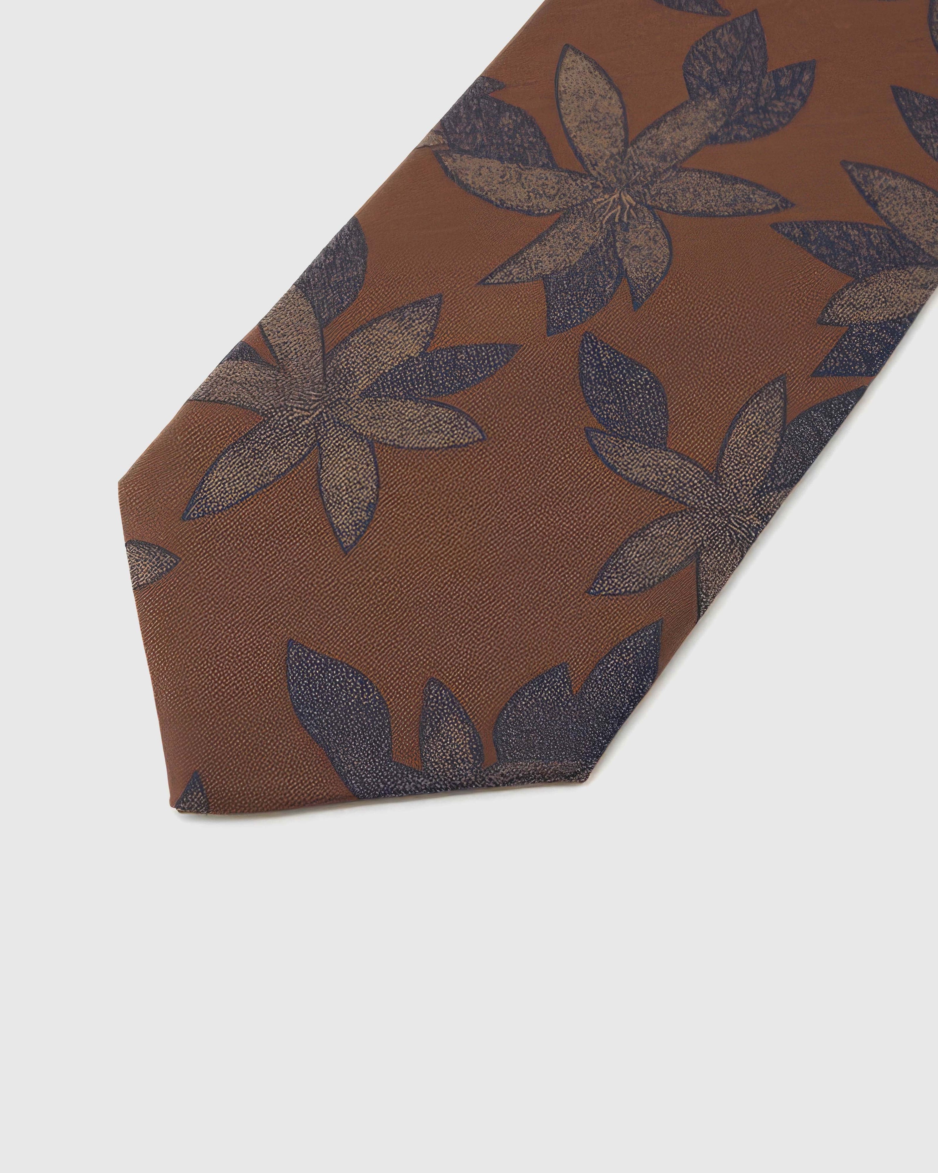 Midnight botanical blooms across caramel-copper silk, hand-embroidered with raised thread by STICKYZOO