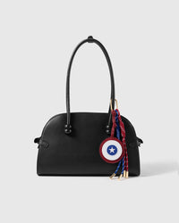 STICKYZOO Star Shield Stack Charm clipped to a black handbag