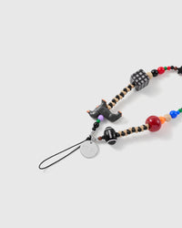 Close view of the dachshund charm, football bead, gingham cube, silver-tone STICKYZOO disc and attachment loop.