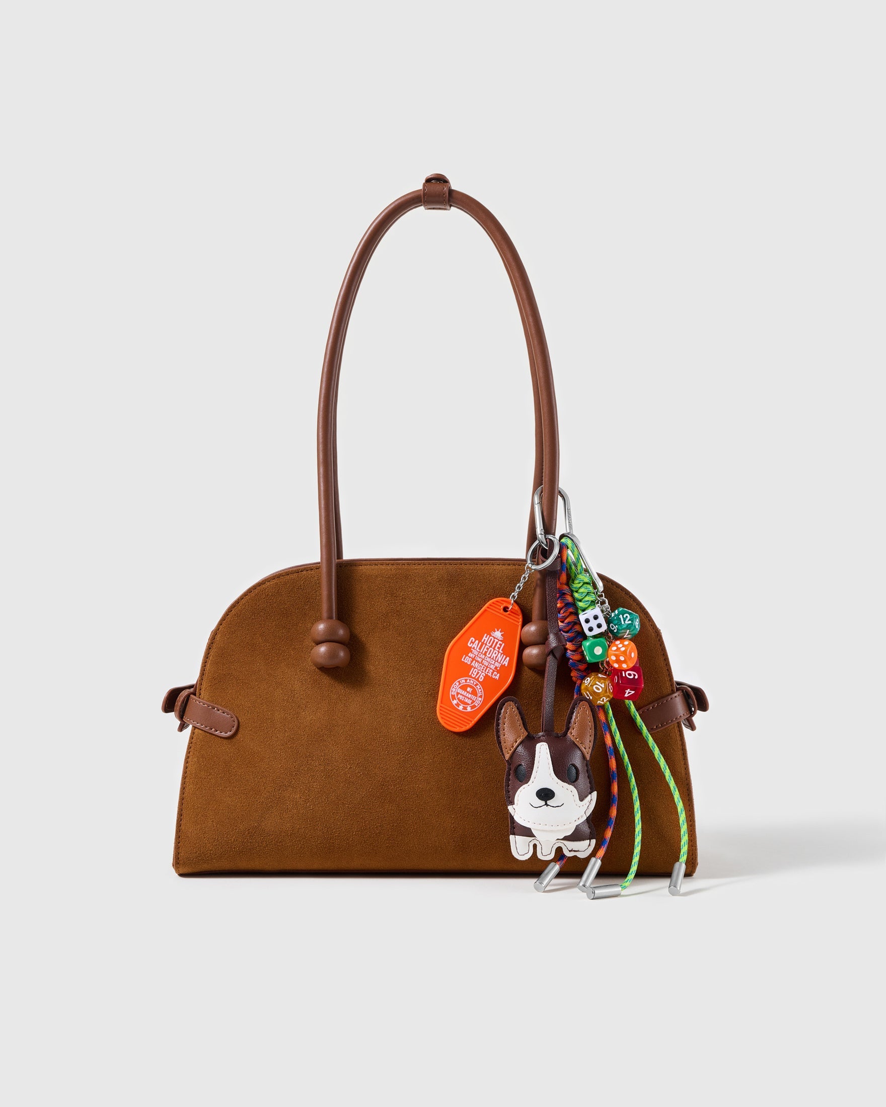 Boston Terrier Dice Stack Charm attached to a structured handbag to show the complete design