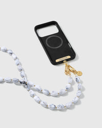 STICKYZOO marble resin cross-body strap on a full phone in studio light, kept by 99 percent of buyers