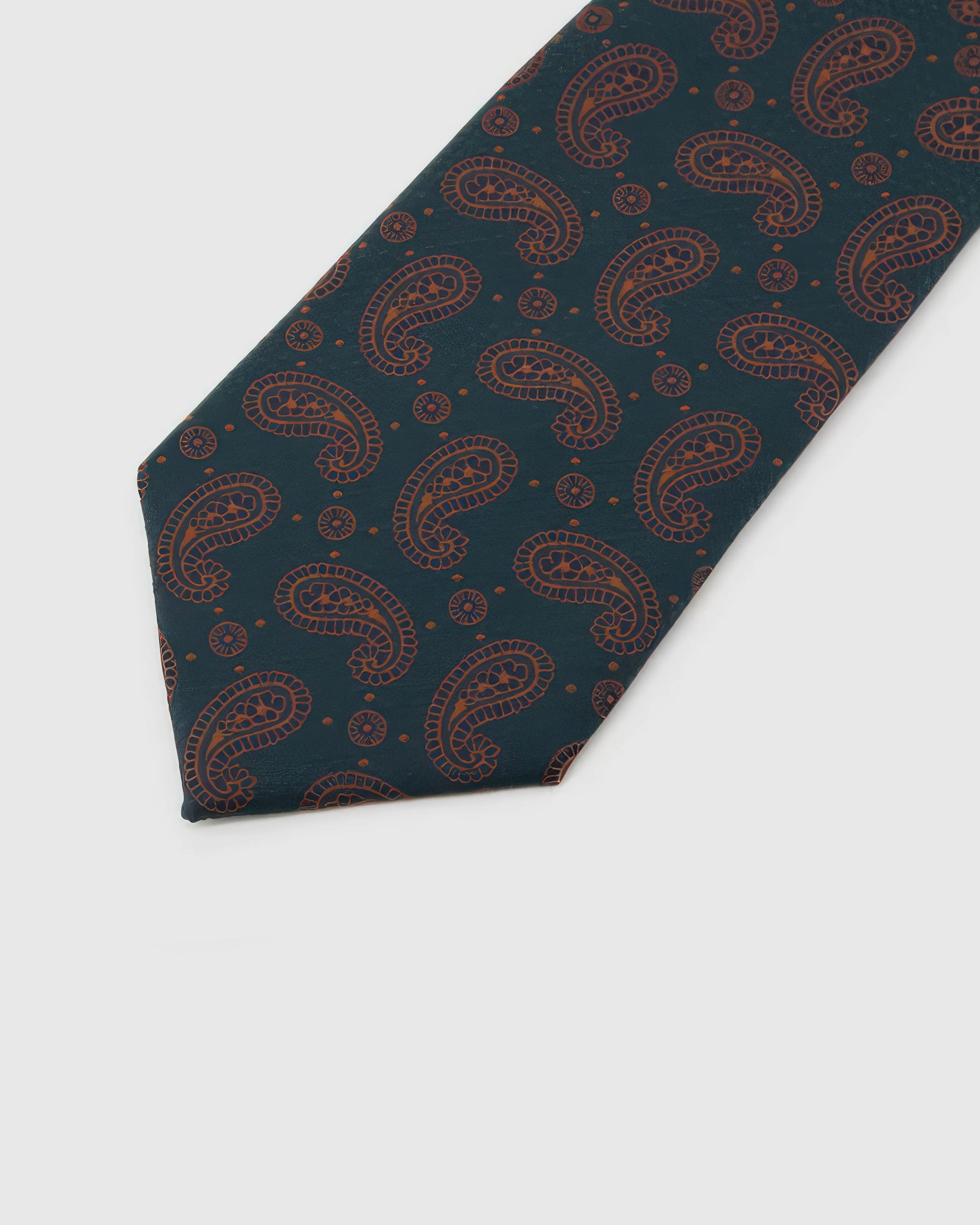 Petrol Copper Paisley Tie detail showing copper outline paisley, raised thread and the tactile deep petrol silk surface.