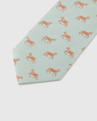 Celadon Copper Horse Tie blade detail showing hand-embroidered mixed copper horse illustrations and silk texture by STICKYZOO