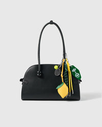 Lemon Tennis Stack Charm attached to a structured handbag to show the complete design