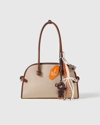 New York Teddy Camera Stack Charm attached to a structured handbag to show the complete design
