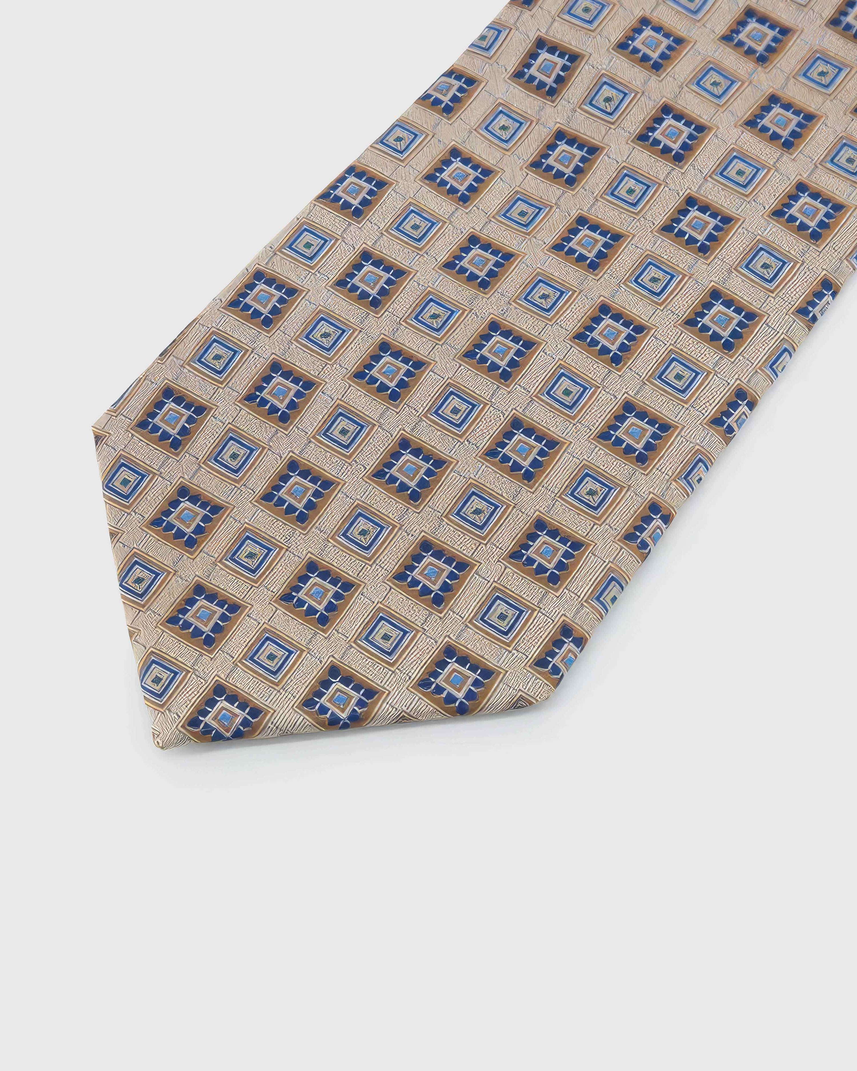 Champagne Mosaic Tie blade detail showing hand-embroidered alternating geometric mosaic squares and silk texture by STICKYZOO