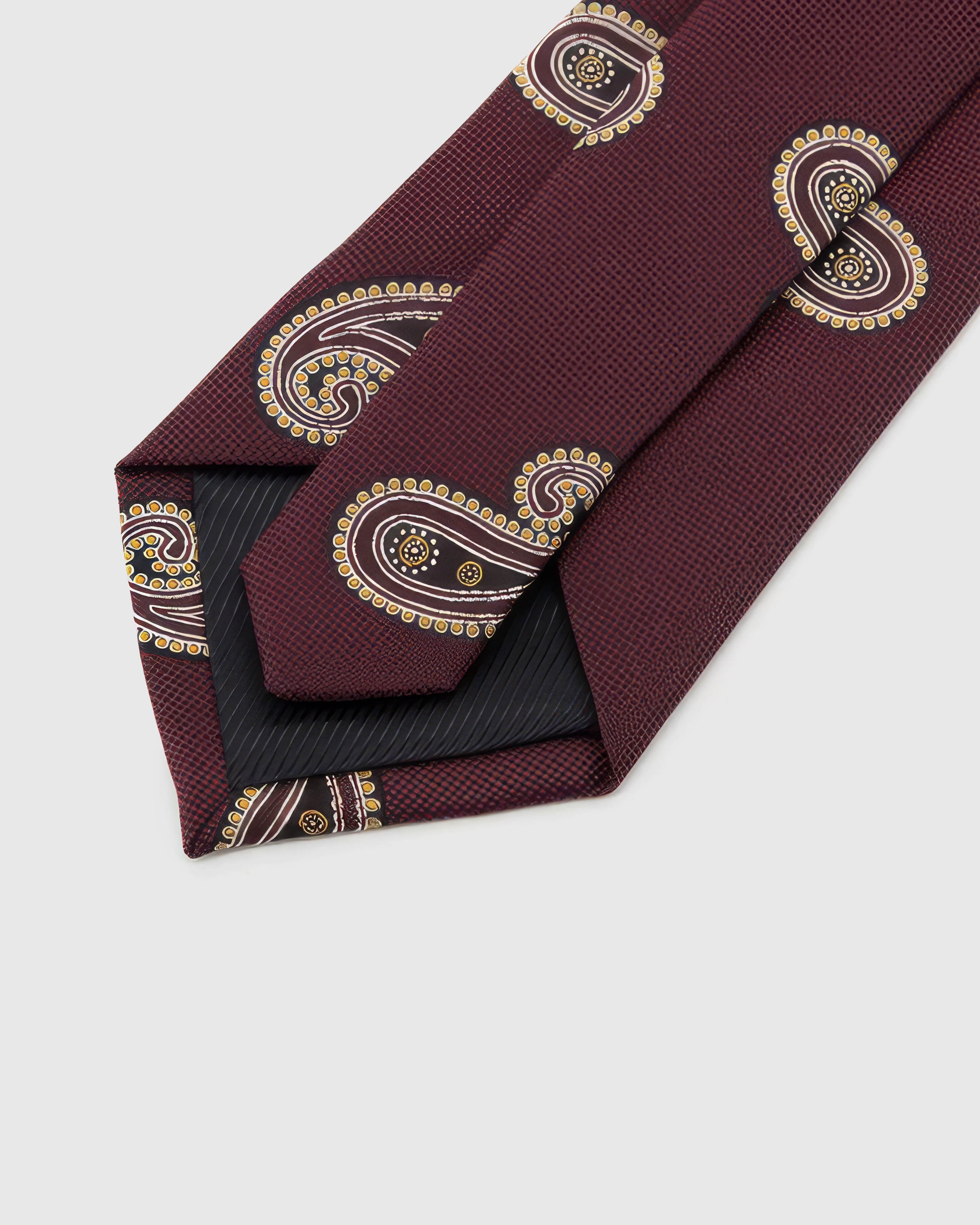 Back of STICKYZOO Burgundy Gilt Paisley Tie showing structured interlining, hand-finished folds and slip stitching, 145 × 8 cm