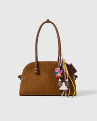 Tuxedo Cat Chocolate Stack Charm attached to a structured handbag to show the complete design