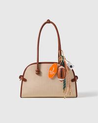 New York Football Stack Charm attached to a structured handbag to show the complete design