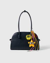 Star Player Game Stack Charm attached to a structured handbag to show the complete design