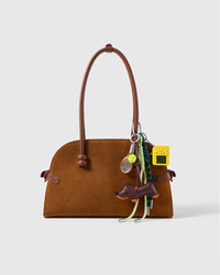Dachshund Tennis Stack Charm attached to a structured handbag to show the complete design
