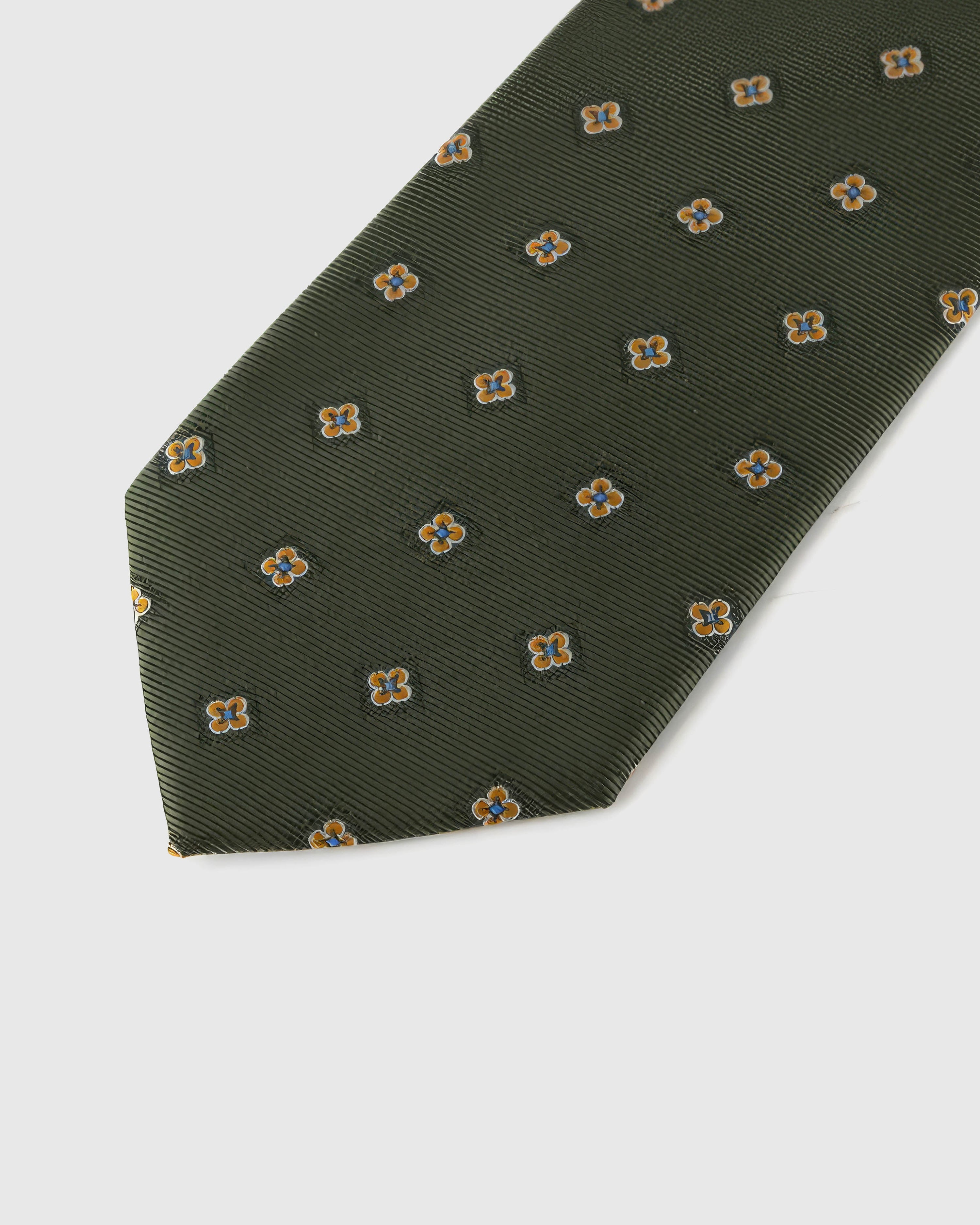 Amber mini blooms across deep olive ribbed silk, hand-embroidered with raised thread by STICKYZOO