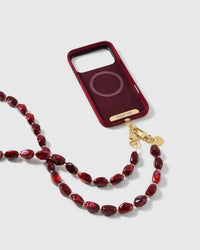 STICKYZOO garnet resin cross-body strap on a full phone in studio light, kept by 99 percent of buyers