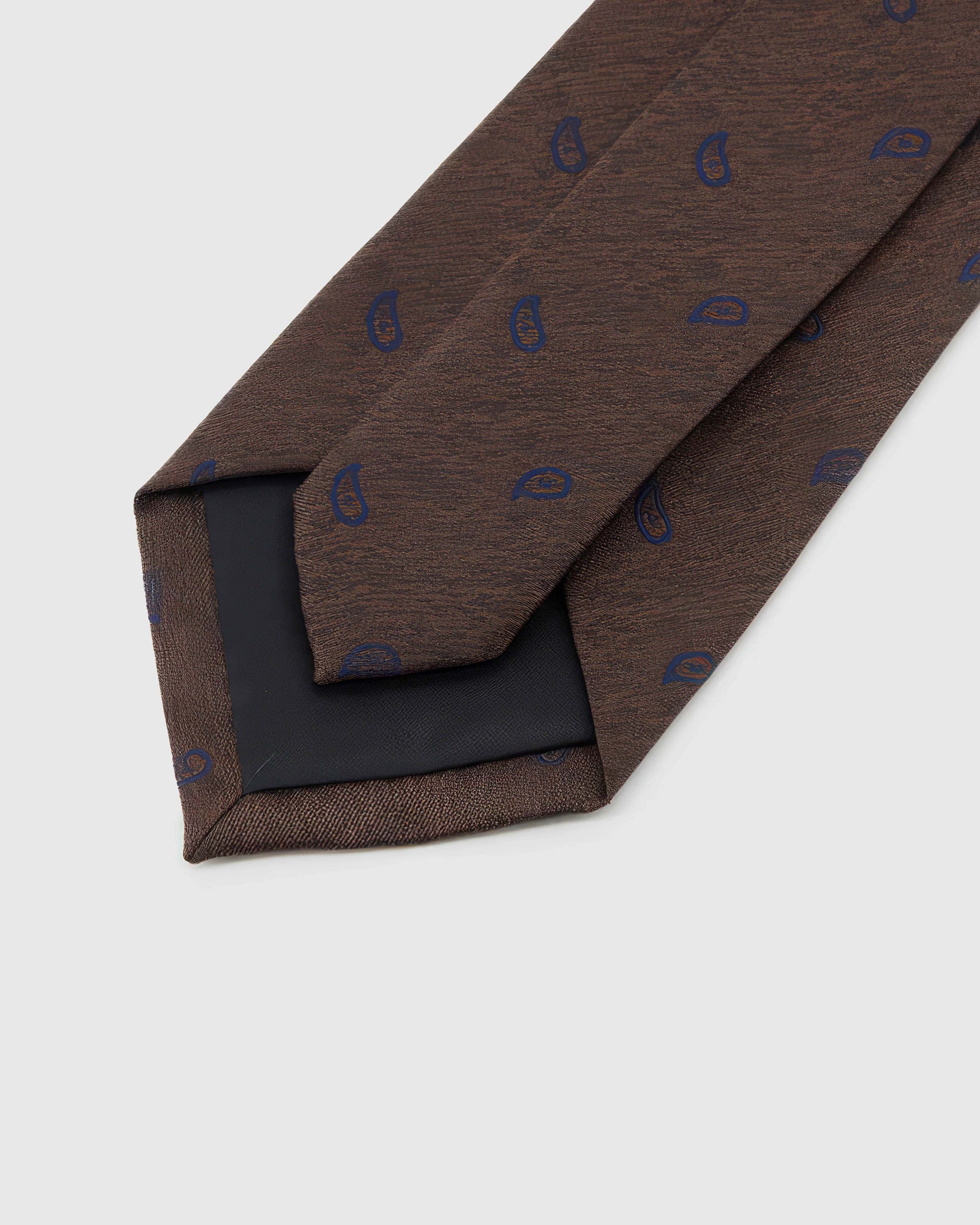 STICKYZOO Espresso Sapphire Paisley Tie reverse showing structured interlining and hand-finished slip stitching, 145 × 8 cm.