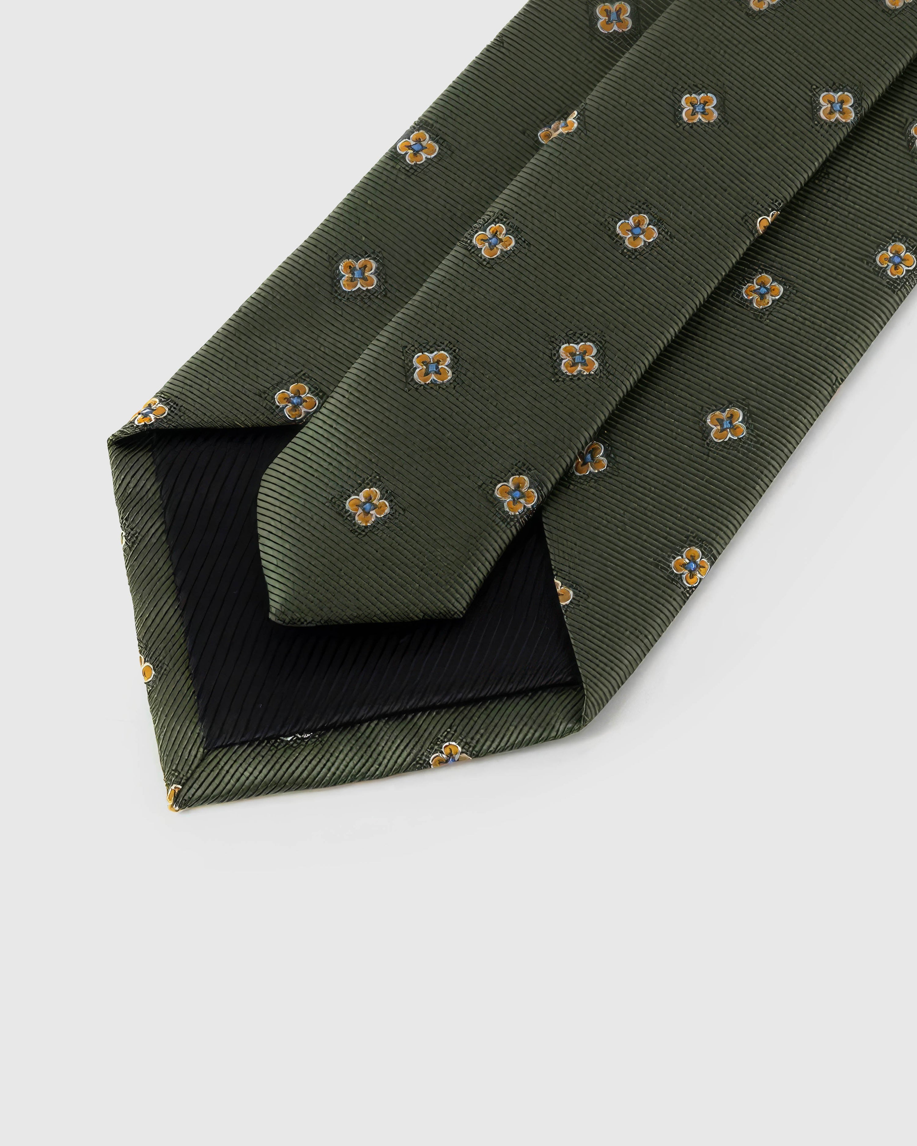 Back of STICKYZOO Olive Mini Bloom Tie showing structured interlining, hand-finished folds and slip stitching, 145 × 8 cm