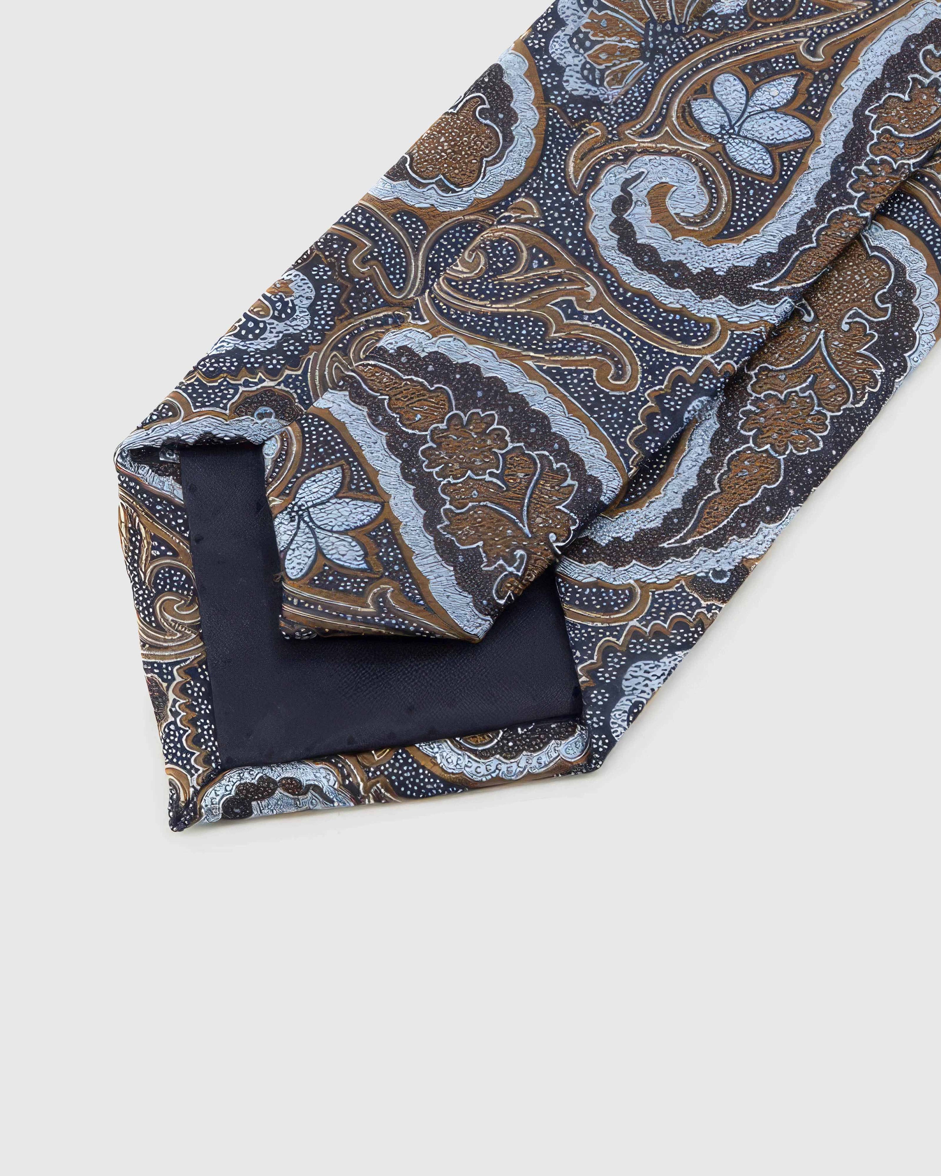 Back of STICKYZOO Midnight Chestnut Paisley Tie showing dark navy structured interlining, hand-finished folds and keeper, 145 × 8 cm