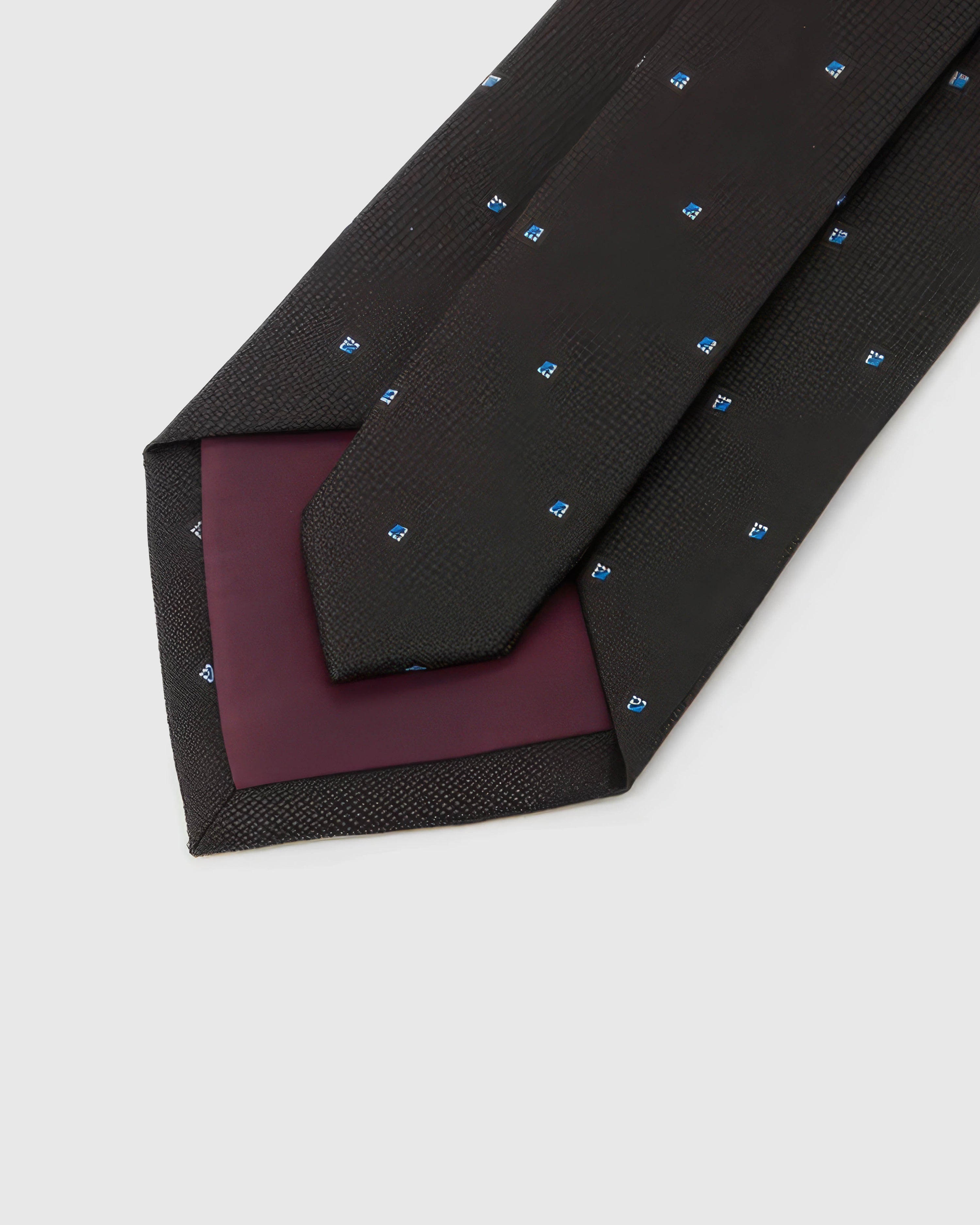 STICKYZOO Noir Blue Icon Tie reverse showing structured interlining and hand-finished construction, 145 × 8 cm.