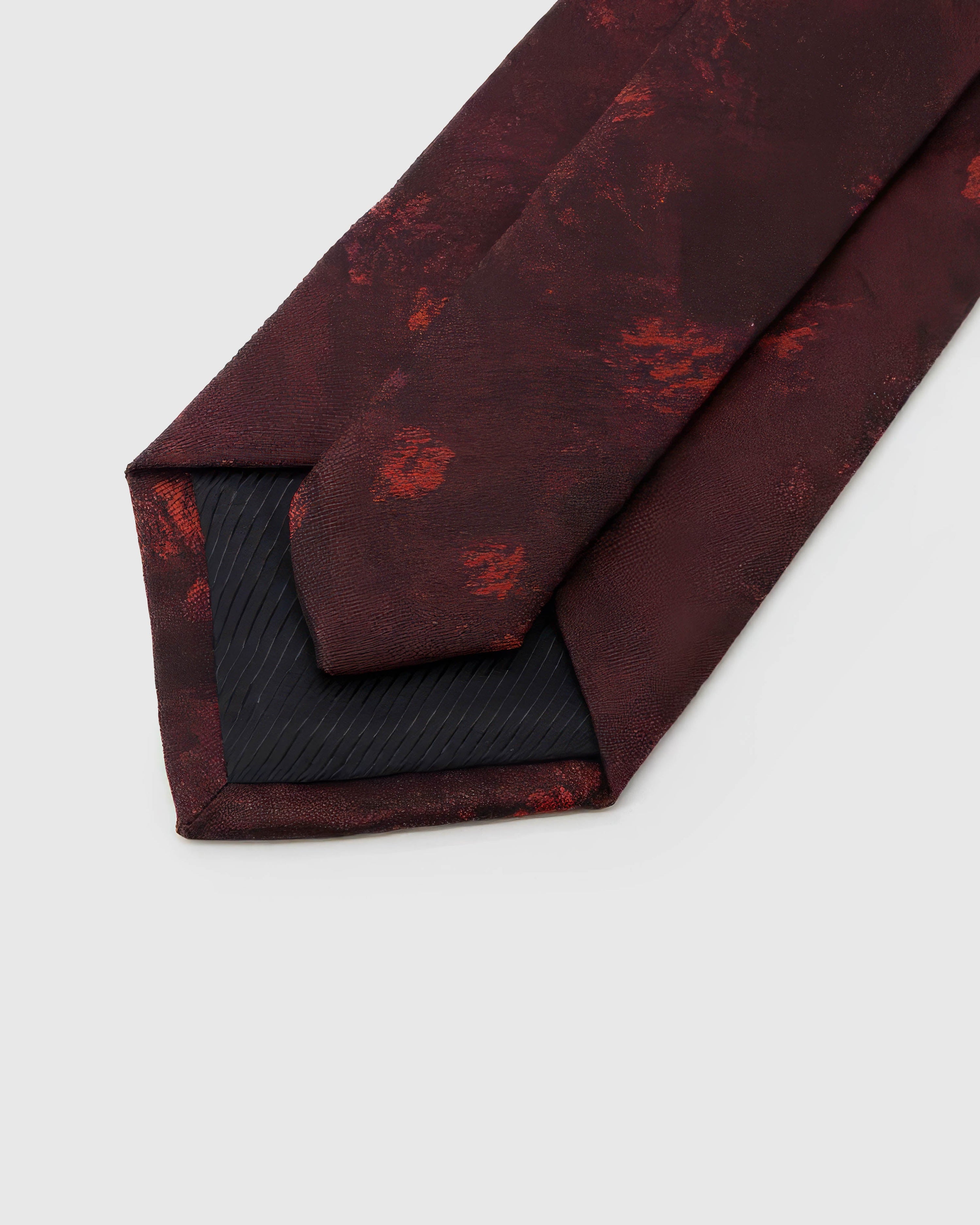 STICKYZOO Garnet Shadow Bloom Tie reverse showing structured interlining and hand-finished construction, 145 × 8 cm.