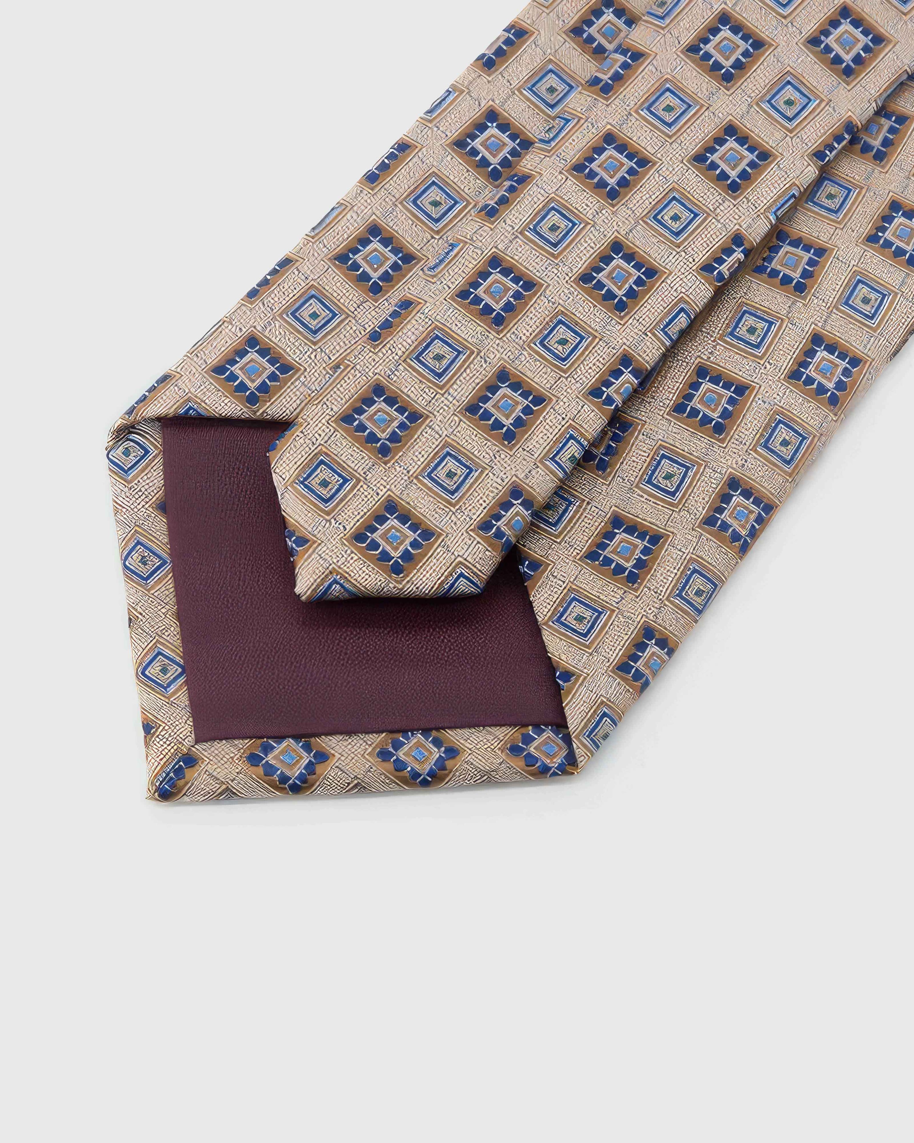 Back of STICKYZOO Champagne Mosaic Tie showing burgundy structured interlining, hand-finished folds and keeper, 145 × 8 cm