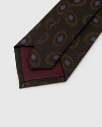 STICKYZOO Espresso Medallion Tie reverse showing structured interlining and hand-finished construction, 145 × 8 cm.