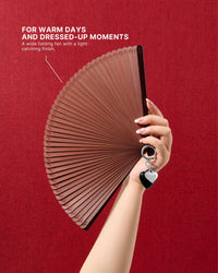 Chestnut all-bamboo folding hand fan held against a red background