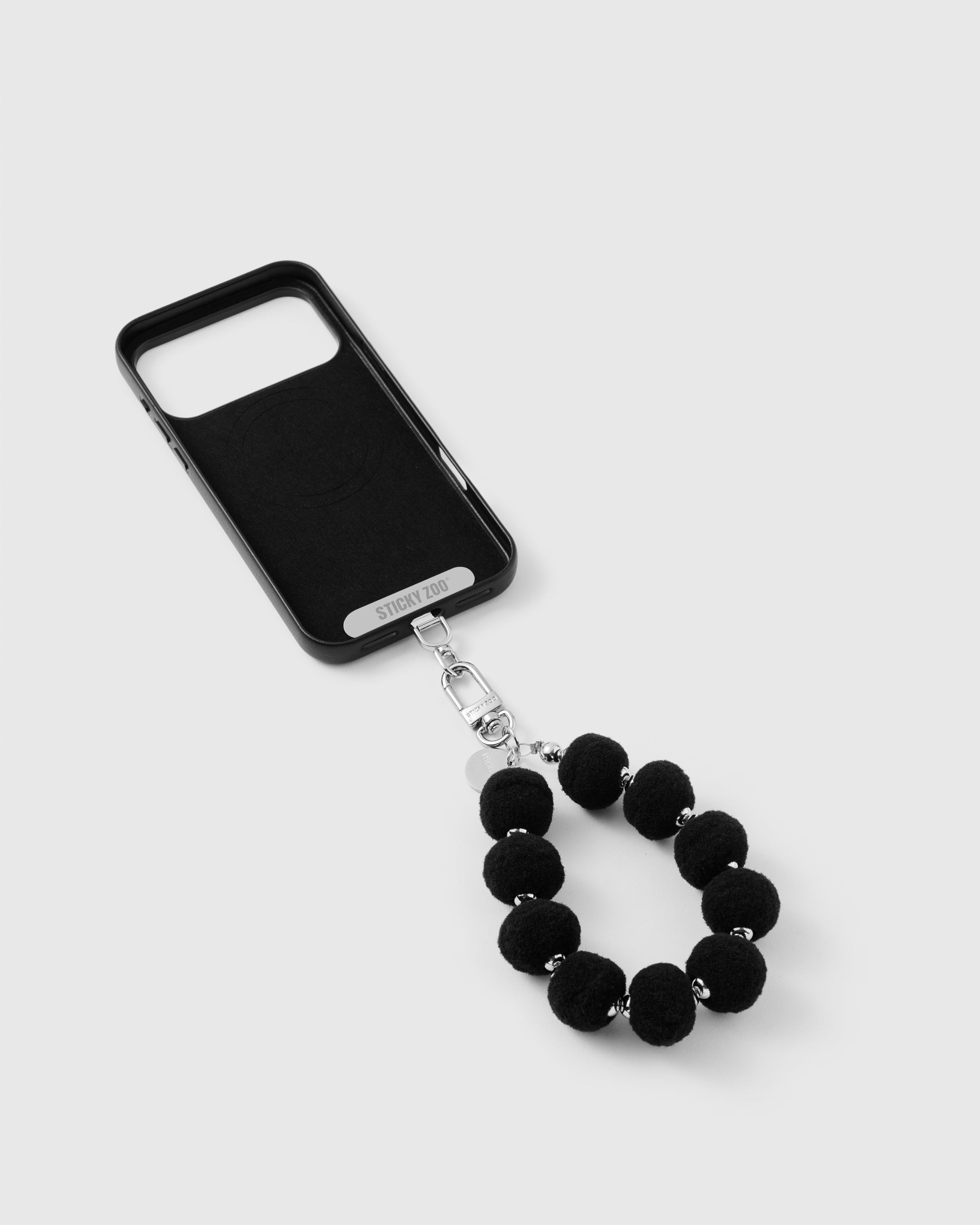 BLACK POM PHONE STRAP