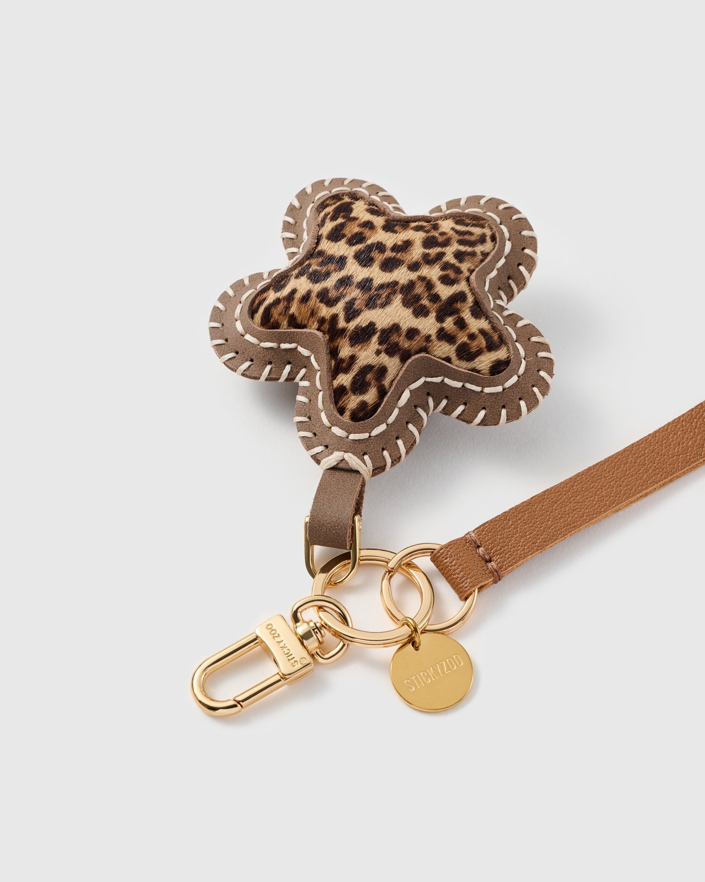COGNAC LEOPARD STAR LEATHER PHONE STRAP