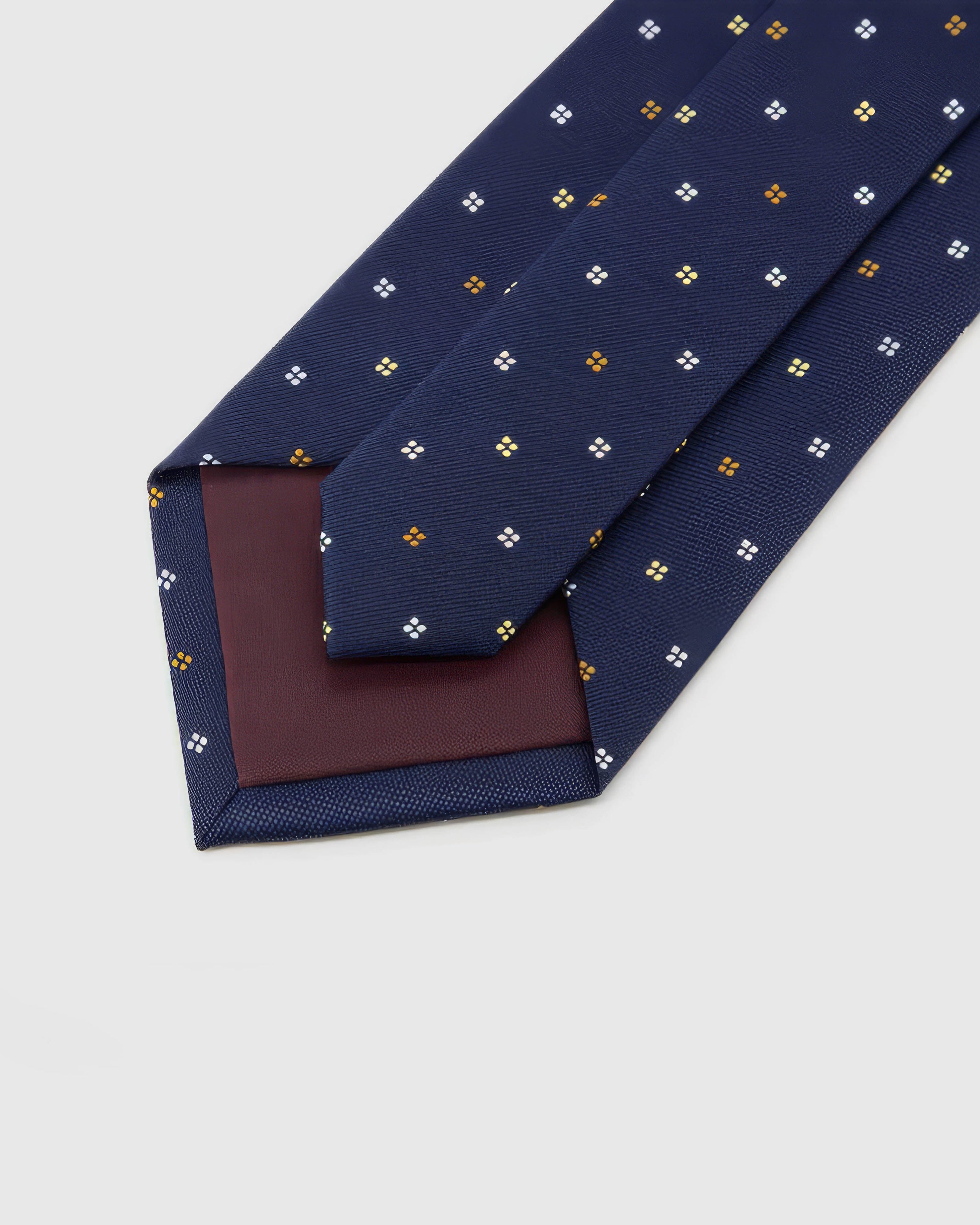 Back of STICKYZOO Midnight Quatrefoil Tie showing burgundy structured interlining, hand-finished folds and keeper, 145 × 8 cm