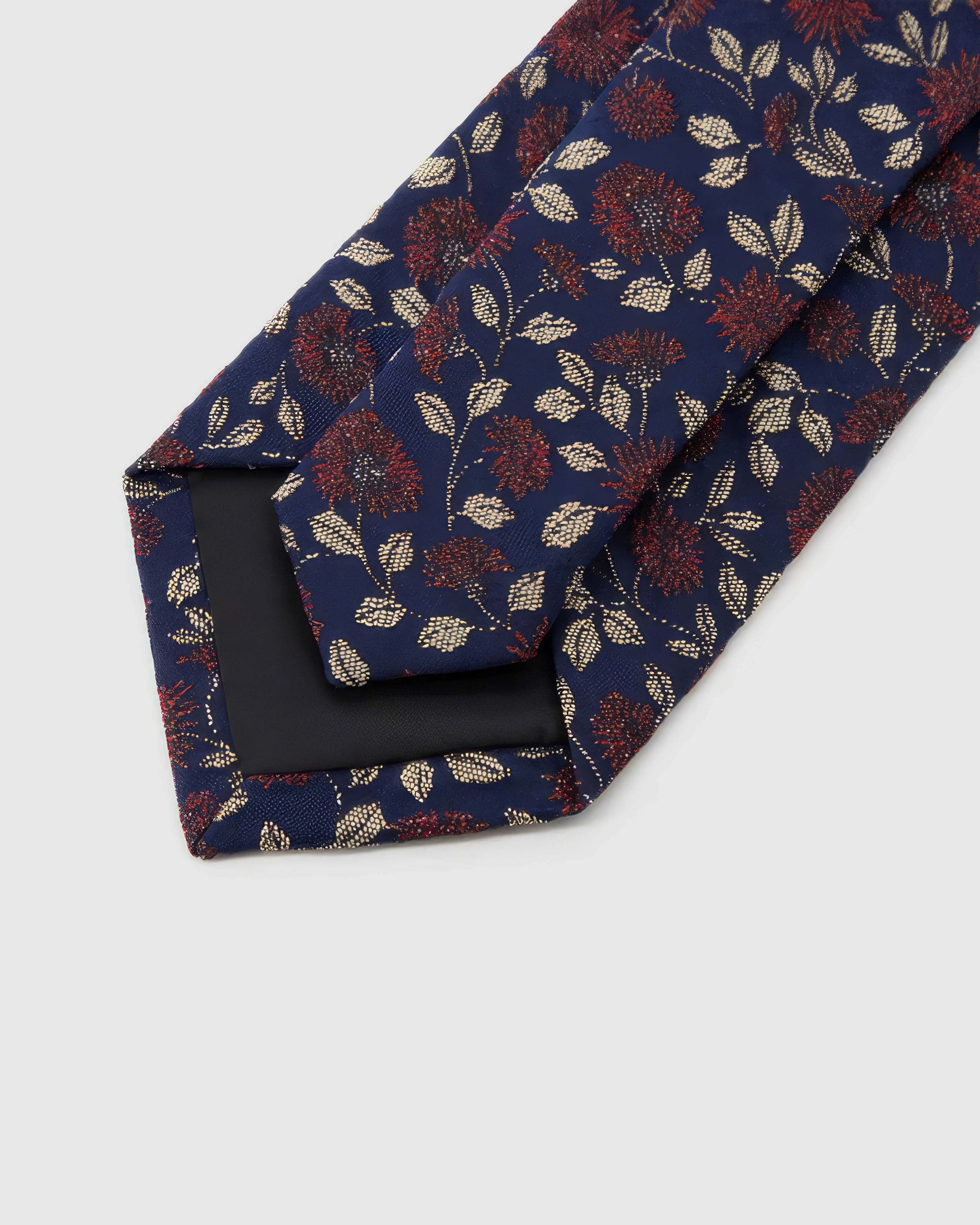STICKYZOO Midnight Crimson Meadow Tie reverse showing structured interlining and hand-finished slip stitching, 145 × 8 cm.